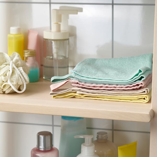 A white TACKAN soap dispenser in the NA