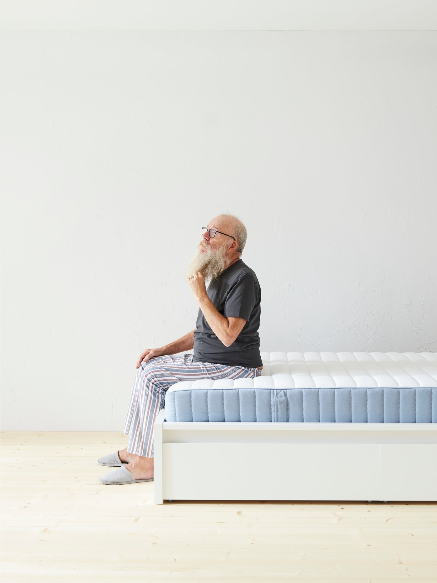 A firm/light blue VALEVÅG pocket sprung mattress