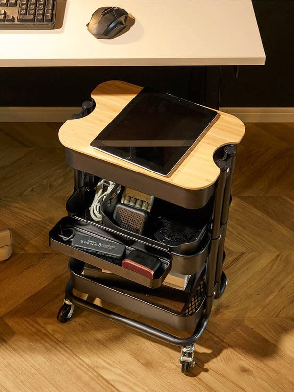 A black RÅSKOG trolley with lid
