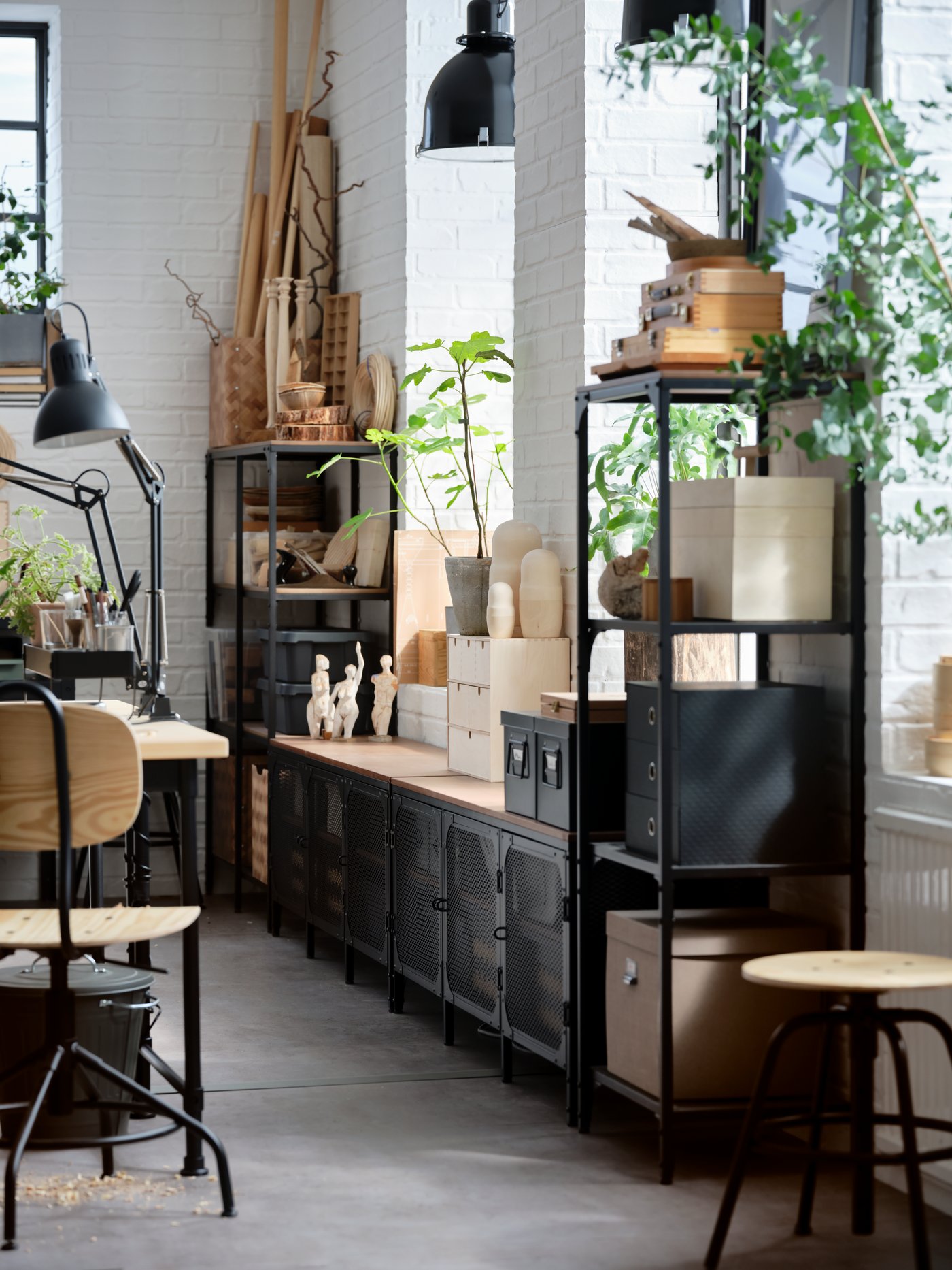 An industrial living room with a black metal cabinet.