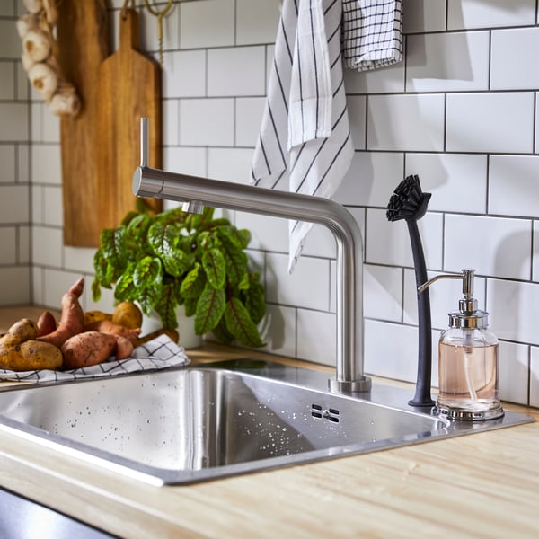 A stainless steel colour BOSJÖN kitchen mixer tap in the kitchen