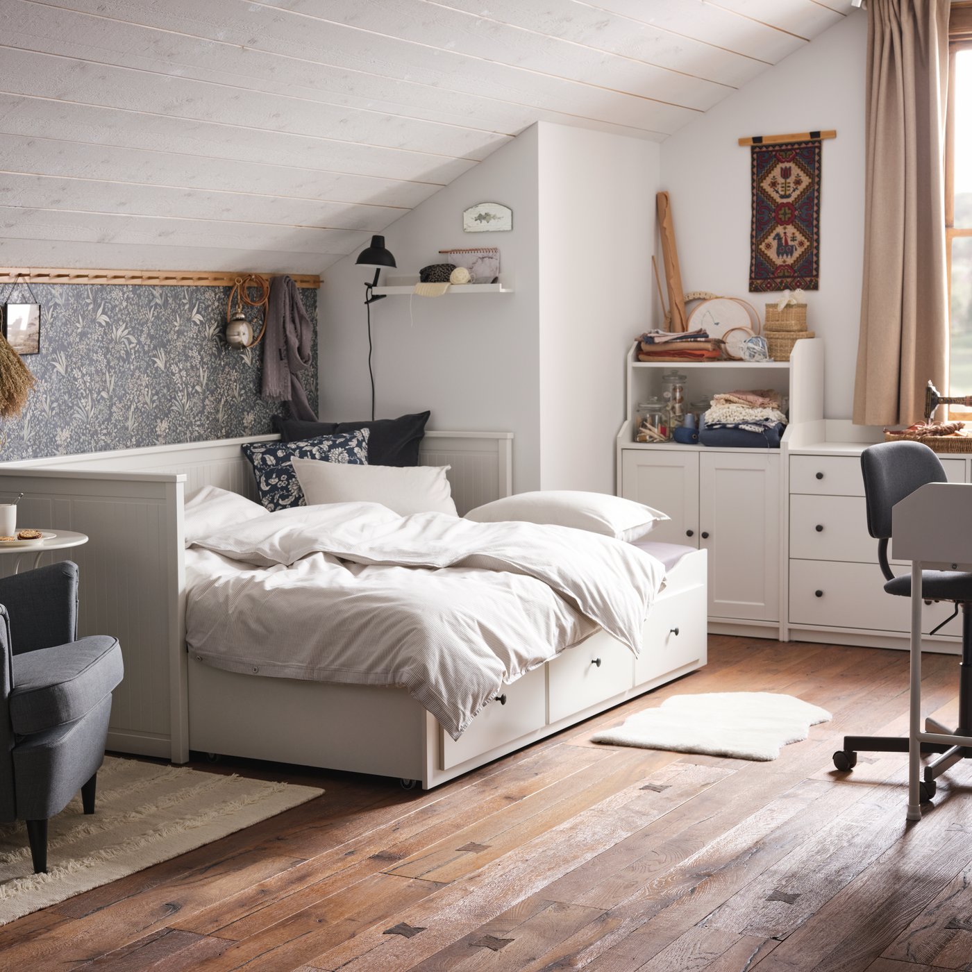 A black SKURUP floor/reading lamp in the bedroom