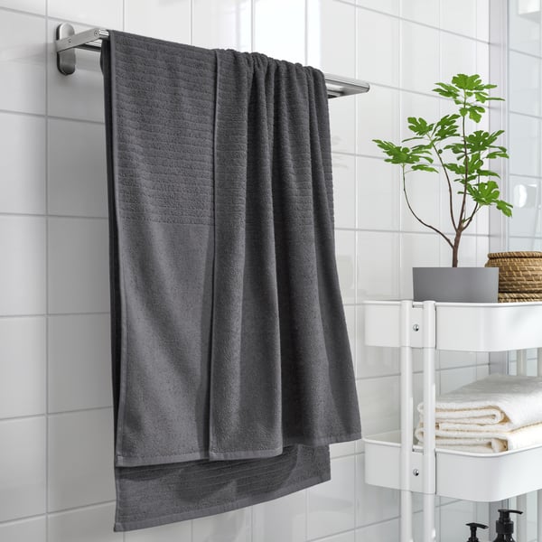 A dark grey VÅGSJÖN bath sheet