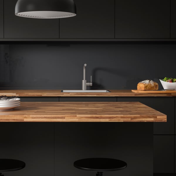 Black kitchen with dark wood worktop
