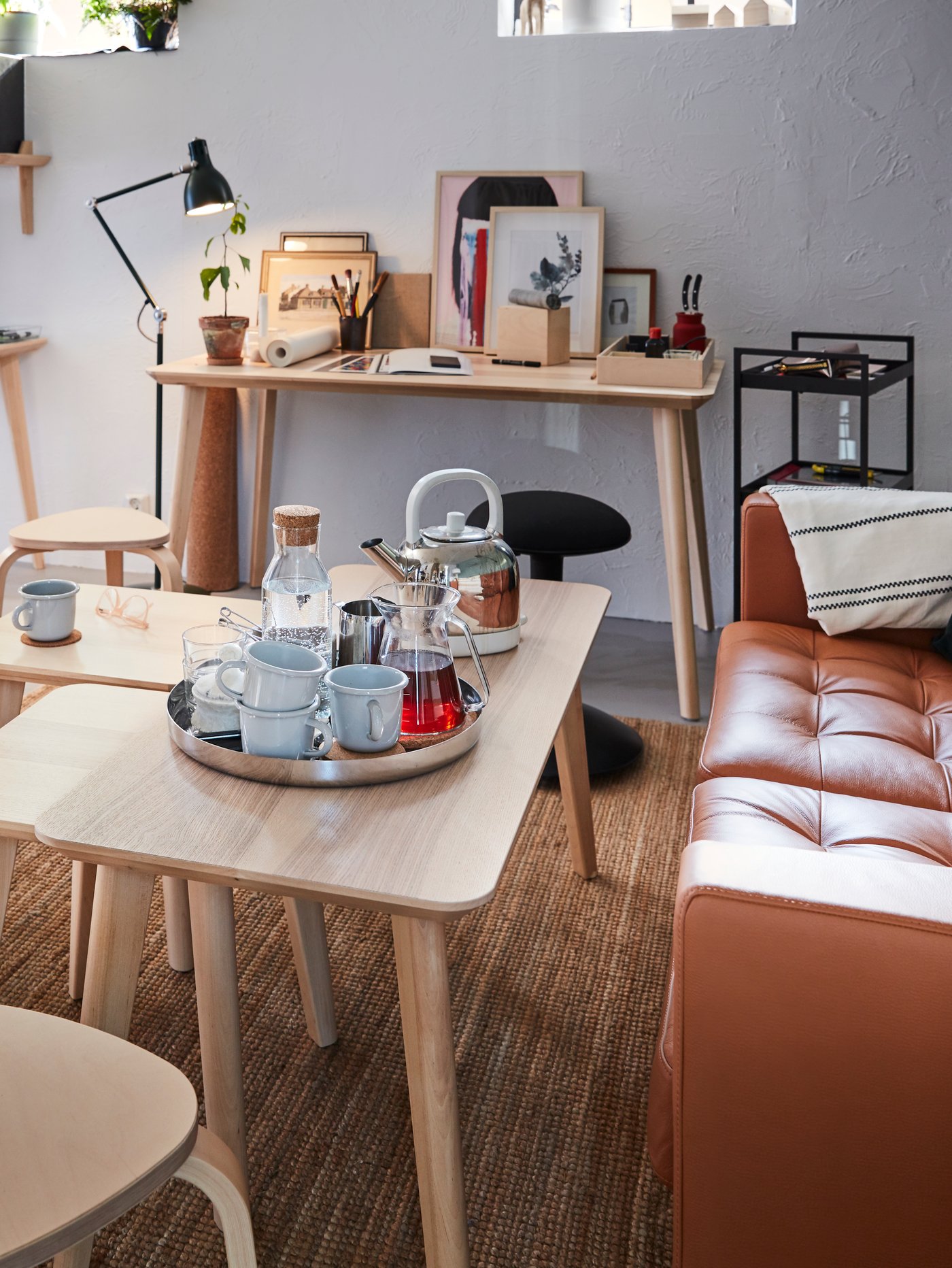 A black NISSAFORS trolley in the living room