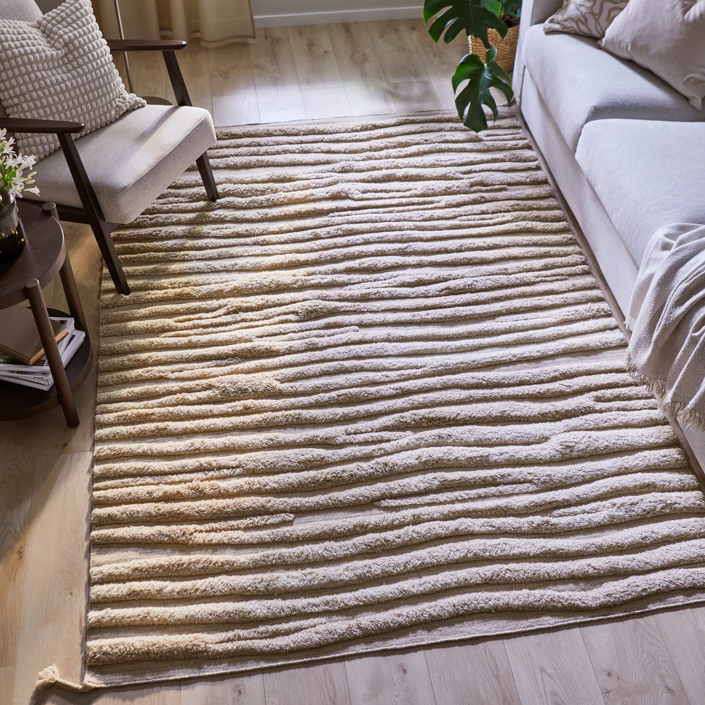 A beige/handmade BANKKONTOR rug, high pile