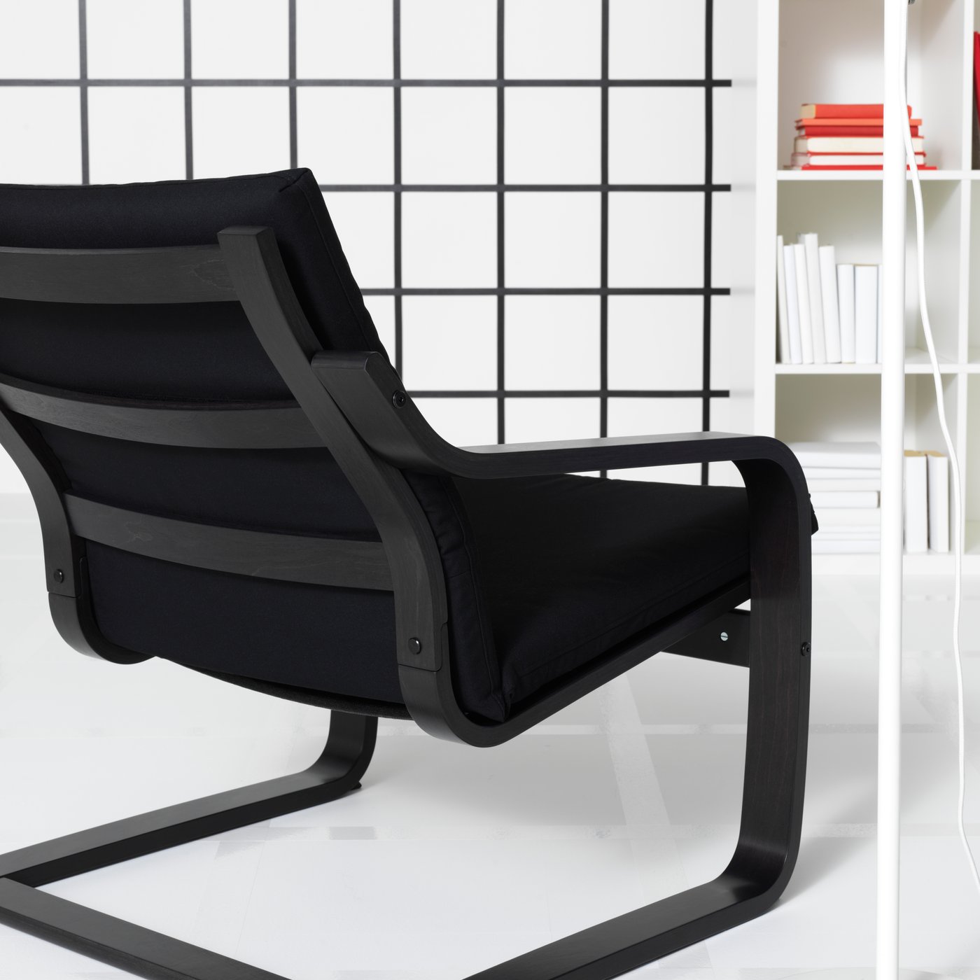 A black-brown POÄNG armchair frame with low back