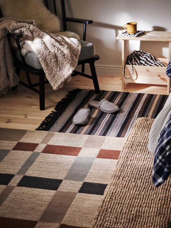 A grey TÅSJÖN slippers in the bedroom