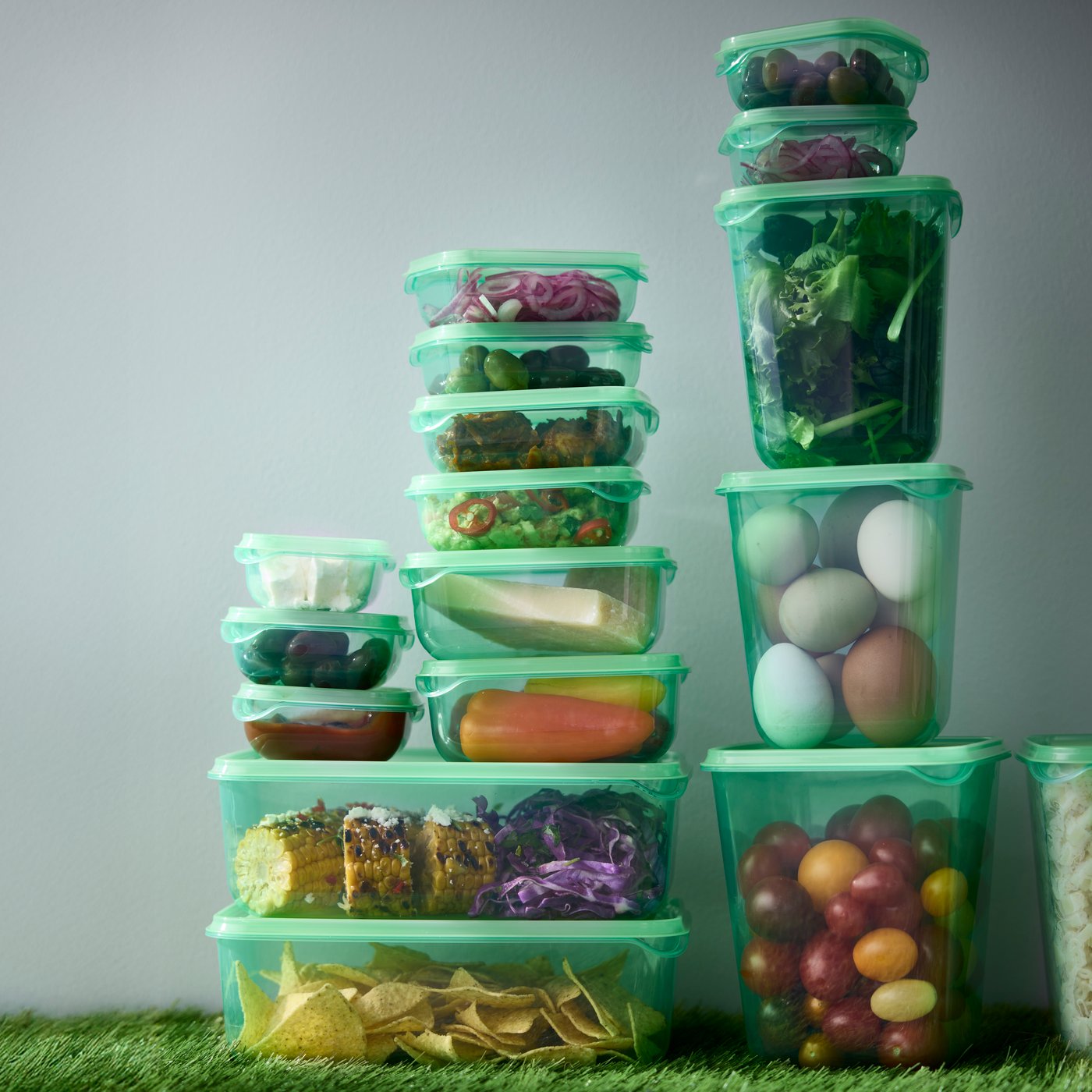 A green PRUTA food container with lid