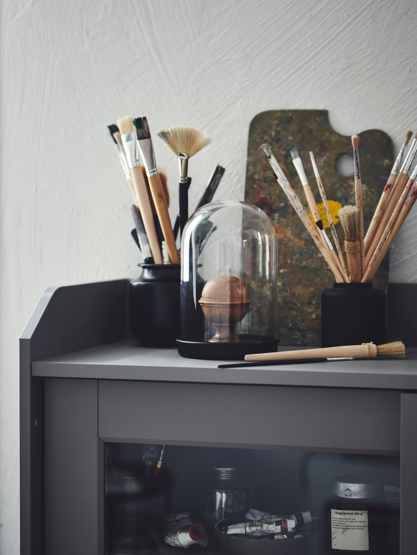 Close-up of a grey HAUGA display cabinet.