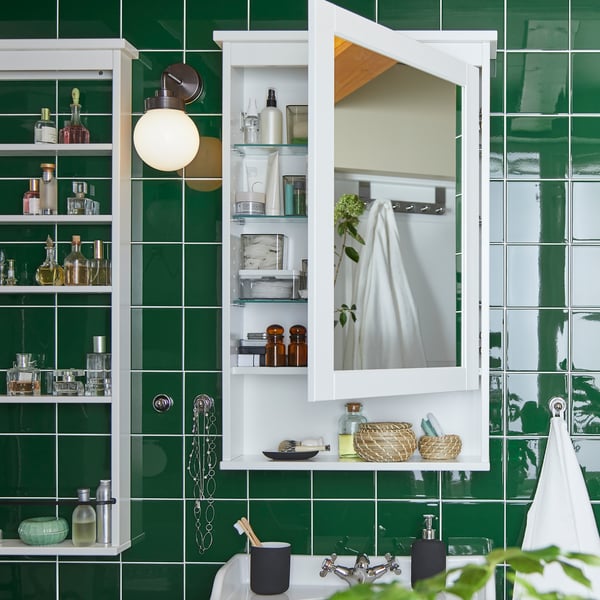 A white HEMNES mirror cabinet with 1 door in the bathroom
