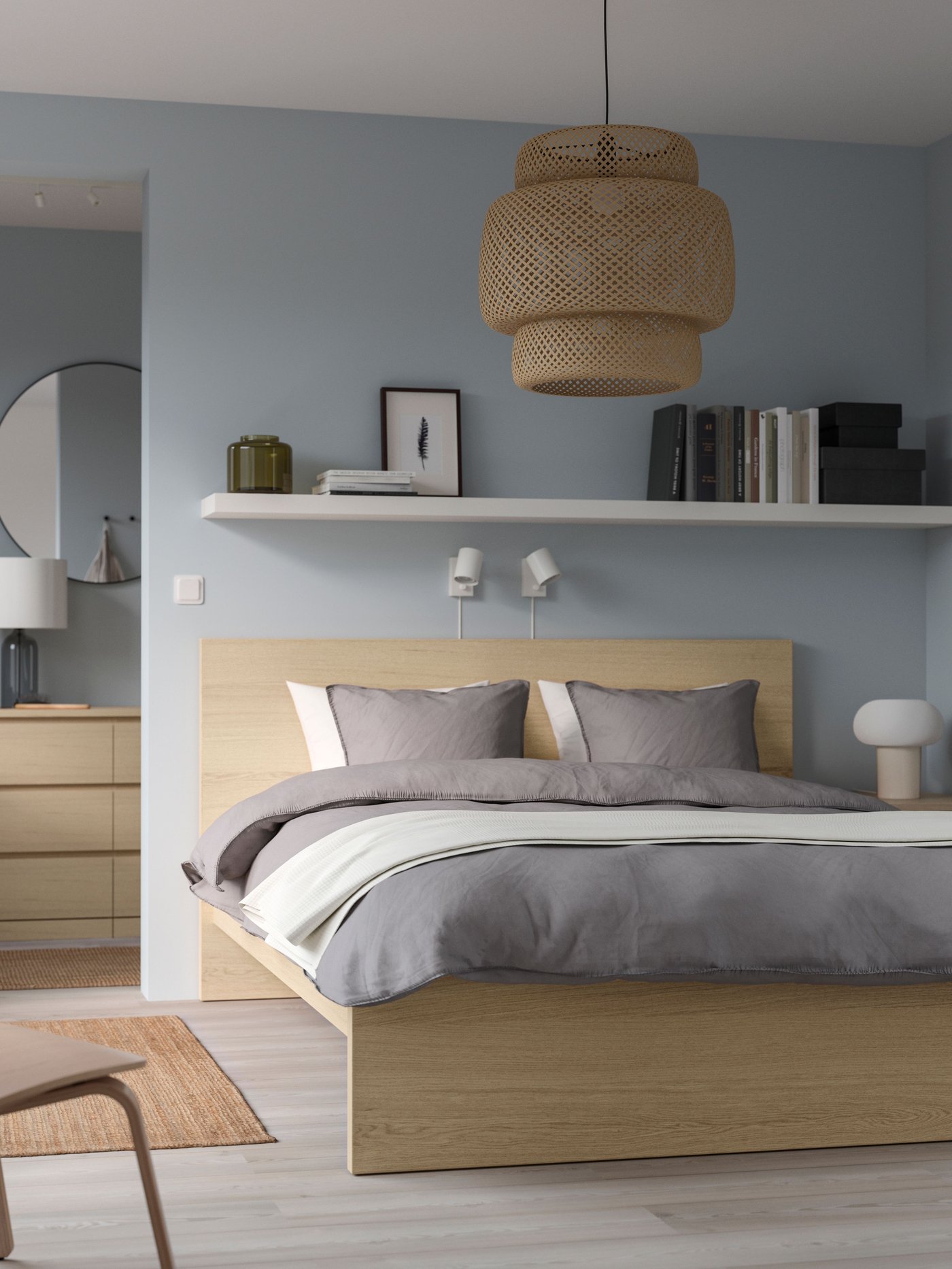 A bamboo/handmade SINNERLIG pendant lamp in the bedroom