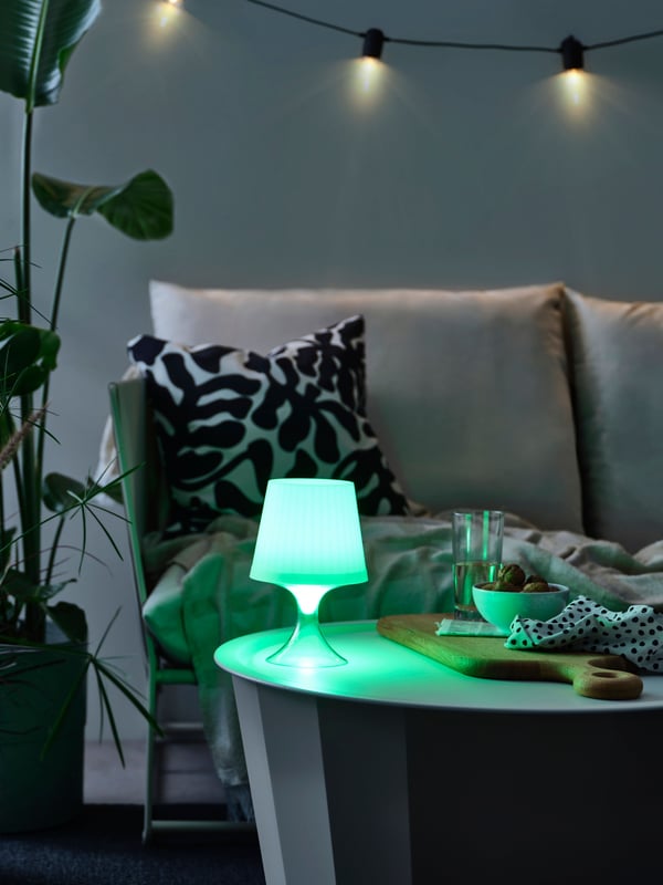 A battery-operated adjustable colour/outdoor white LAMPAN LED portable lamp