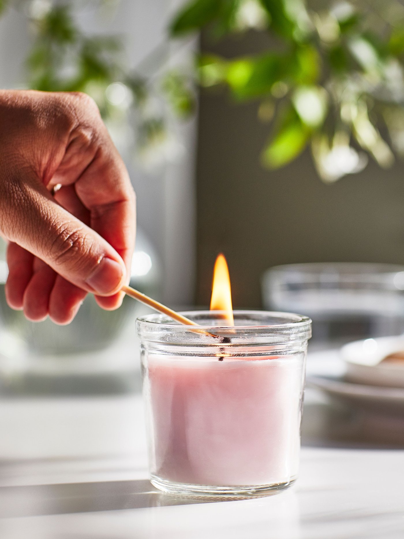 A Jasmine/pink LUGNARE scented candle in glass