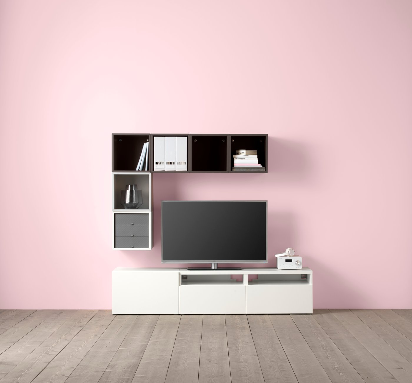 BESTA TV console bench in the living room with table lamp, arm chair, and sofa set with rug on the floor.