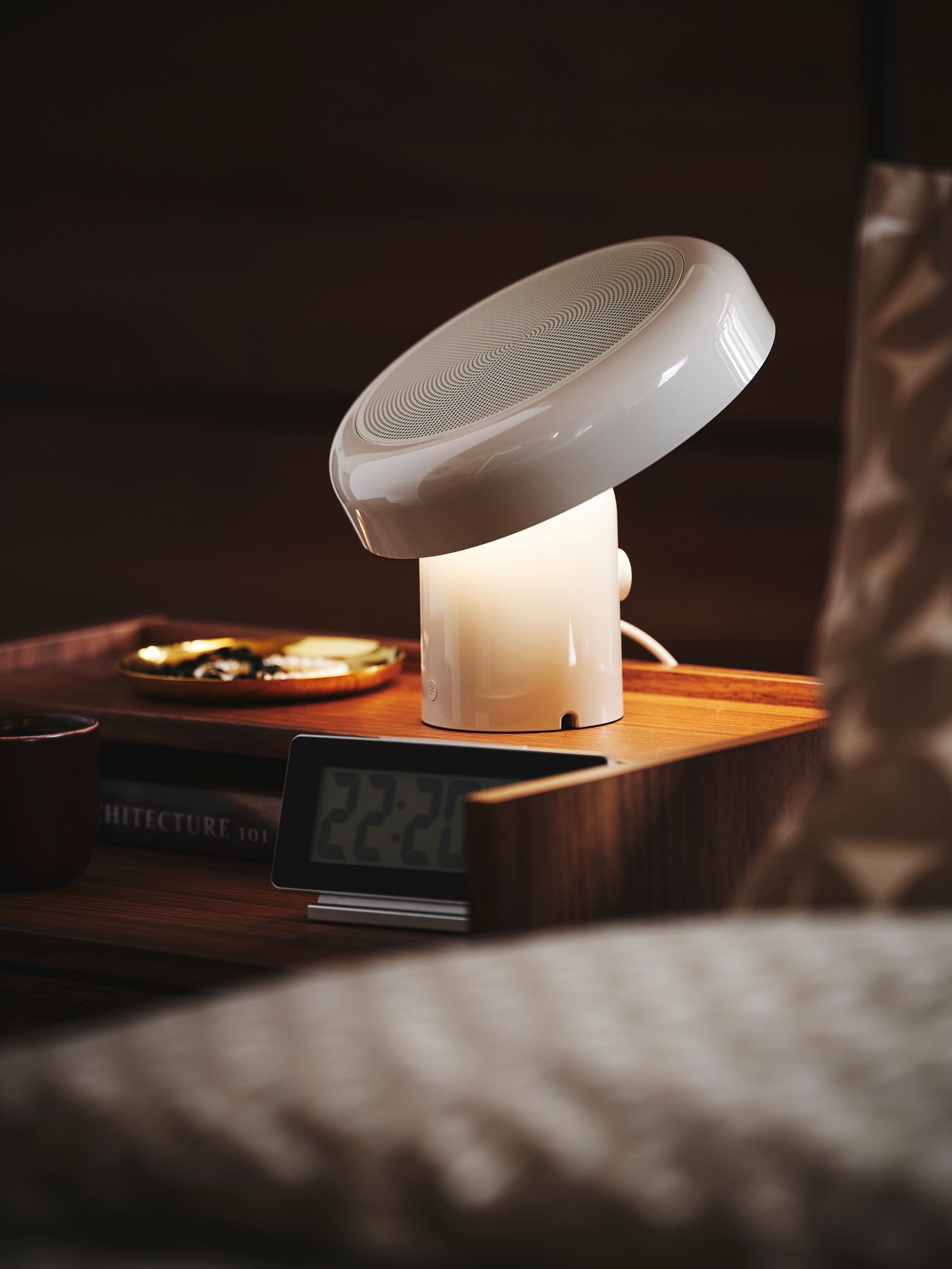 A black FILMIS clock/thermometer/alarm in the bedroom