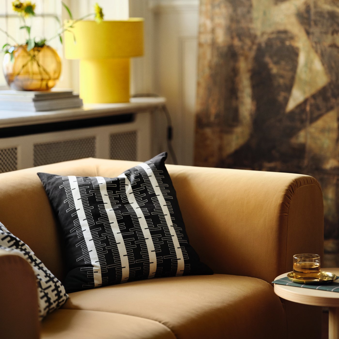 A brass-colour STOCKHOLM 2025 bowl and dish in the living room