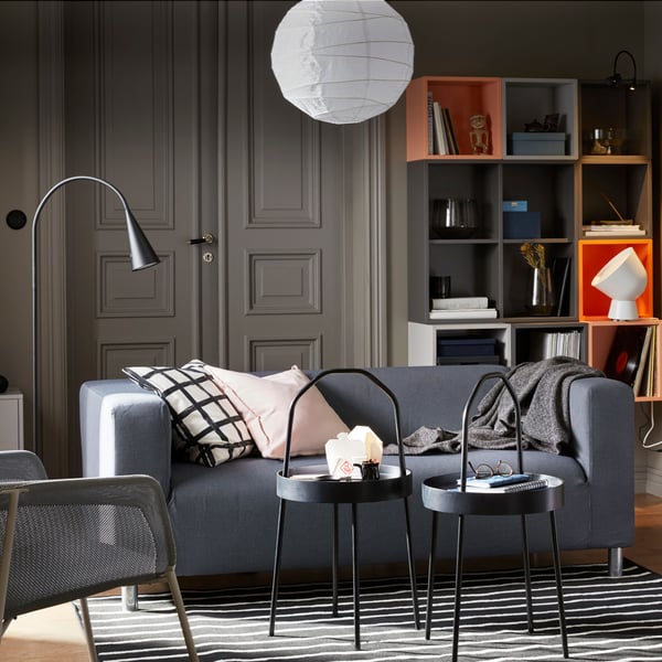 A white IKEA PS 2017 table lamp in the living room