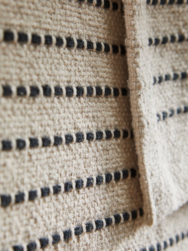 A natural/black STARREKLINTE rug, flatwoven