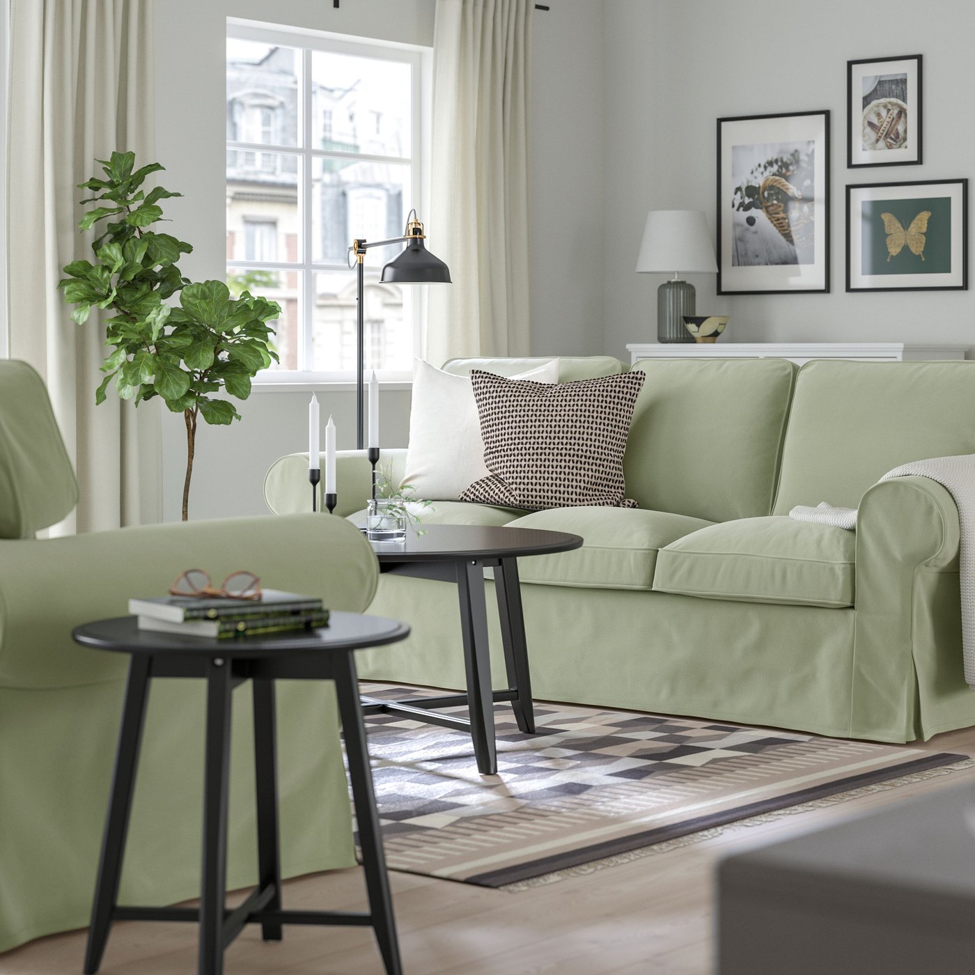 A Hakebo grey-green EKTORP 3-seat sofa in the living room