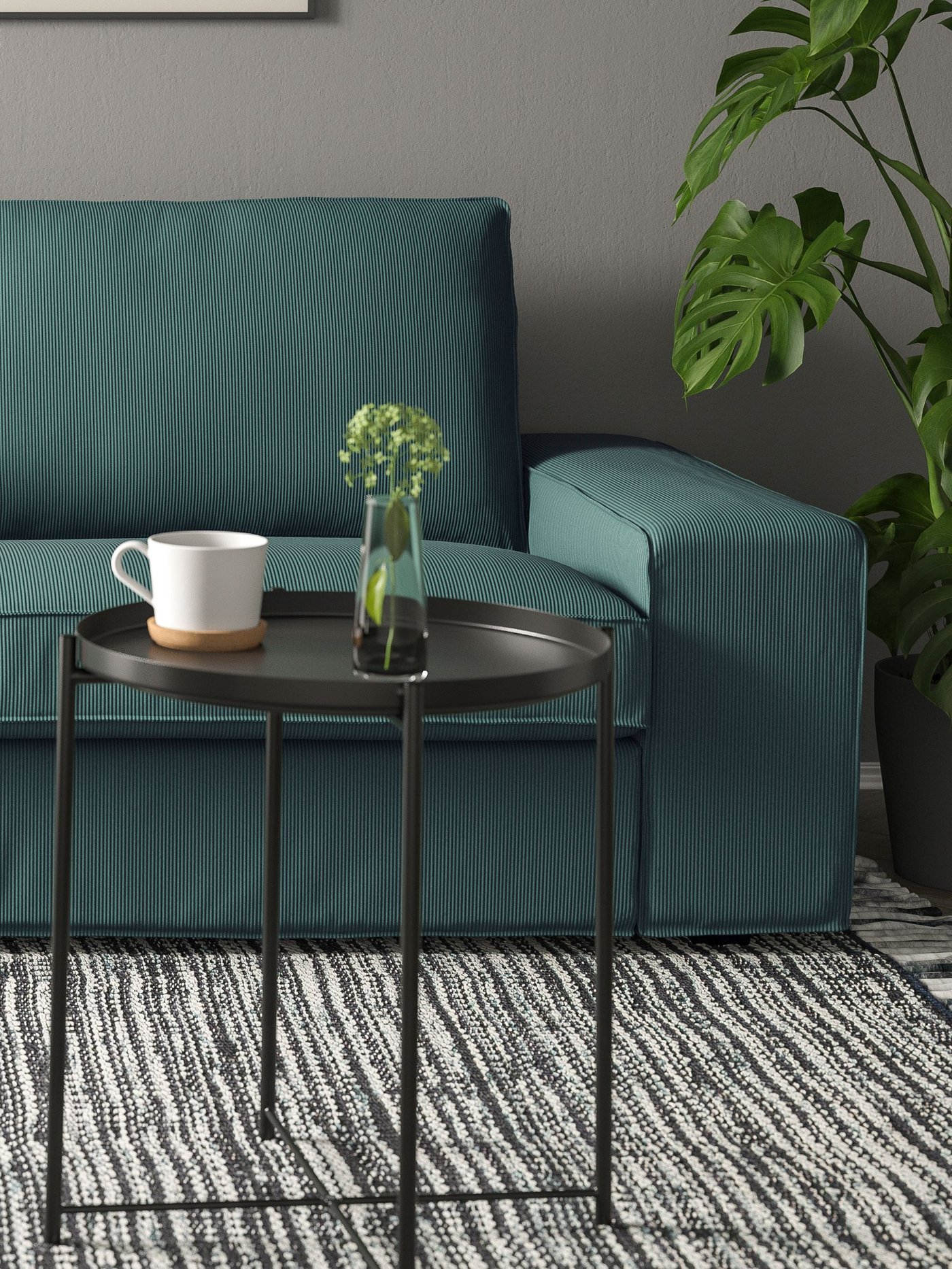 A Kelinge grey-turquoise KIVIK 3-seat sofa in the living room