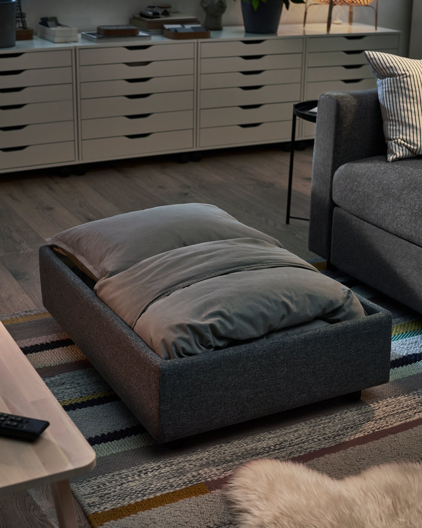 A white ALEX drawer unit on castors in the living room