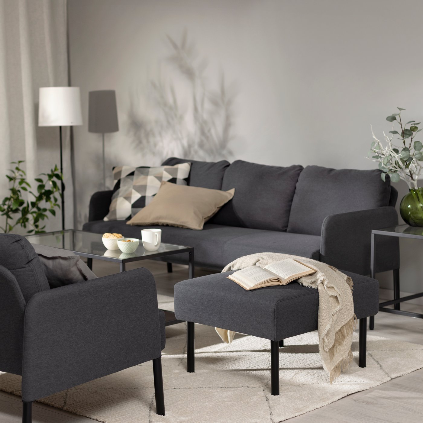 A Knisa dark grey GLOSTAD 3-seat sofa in the living room