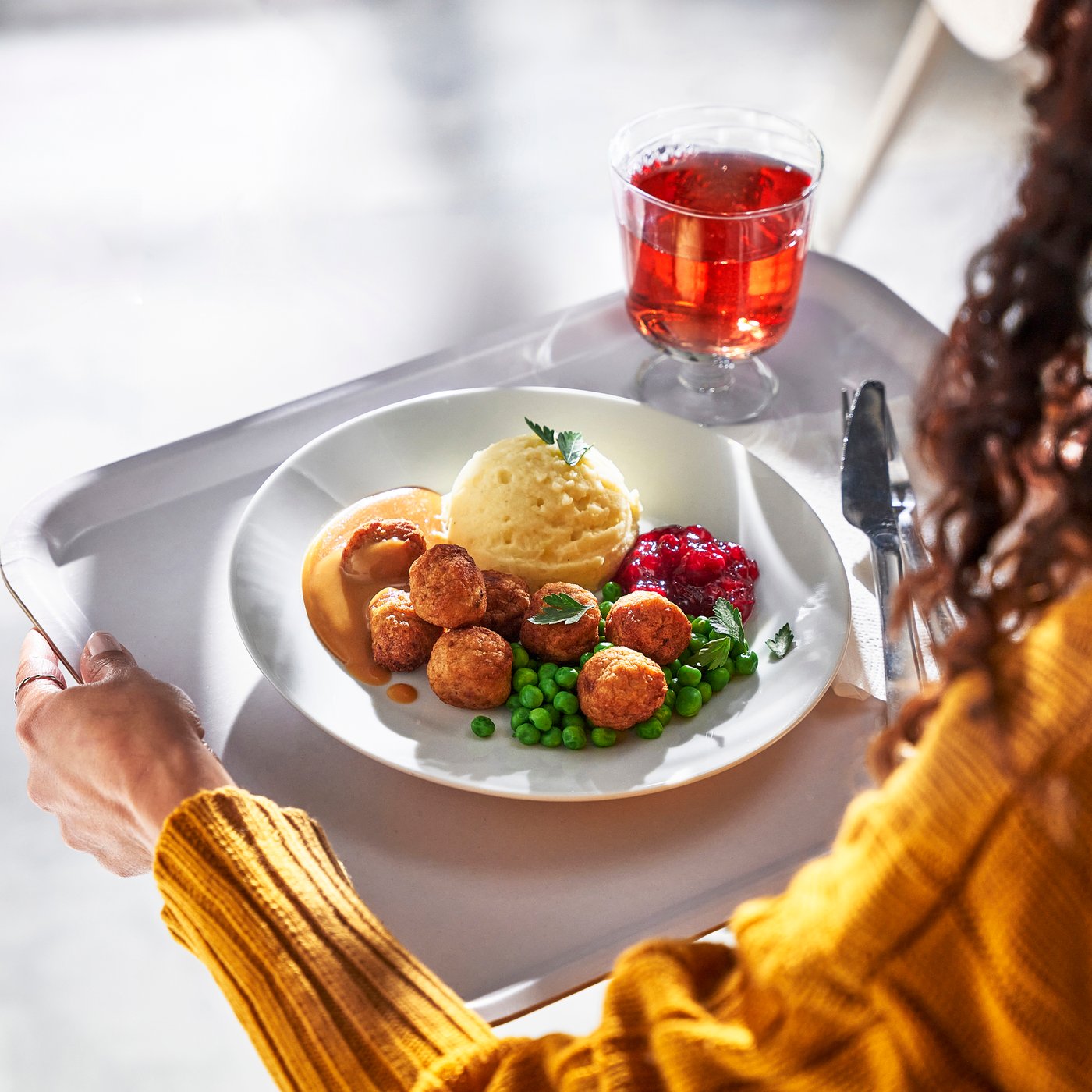 A mashed potatoes green peas /cream sauce and lingonberry jam 8 piece Chicken balls mash peas/crm sauce lingnbrry jam 8p Chicken meatballs