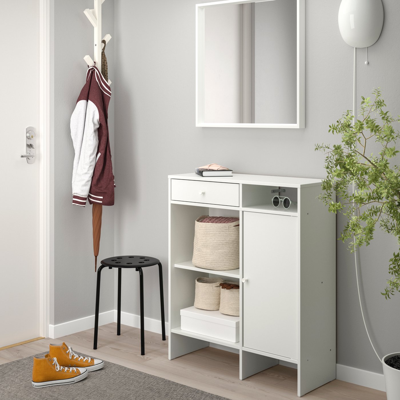 A white BAGGEBO sideboard in the hallway
