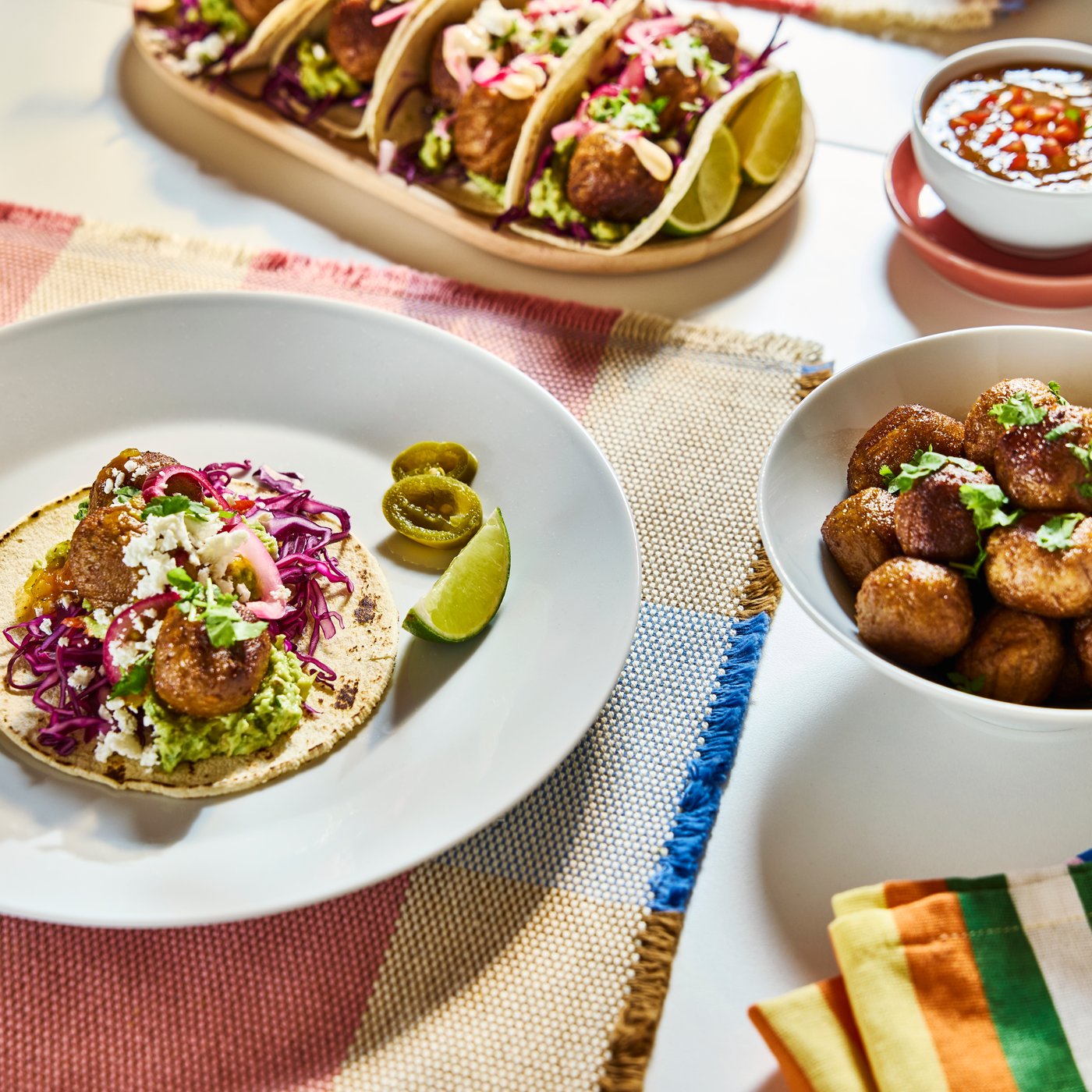 Tacos and HUVUDROLL plant balls on timeless white IKEA 365+ plates and bowls.