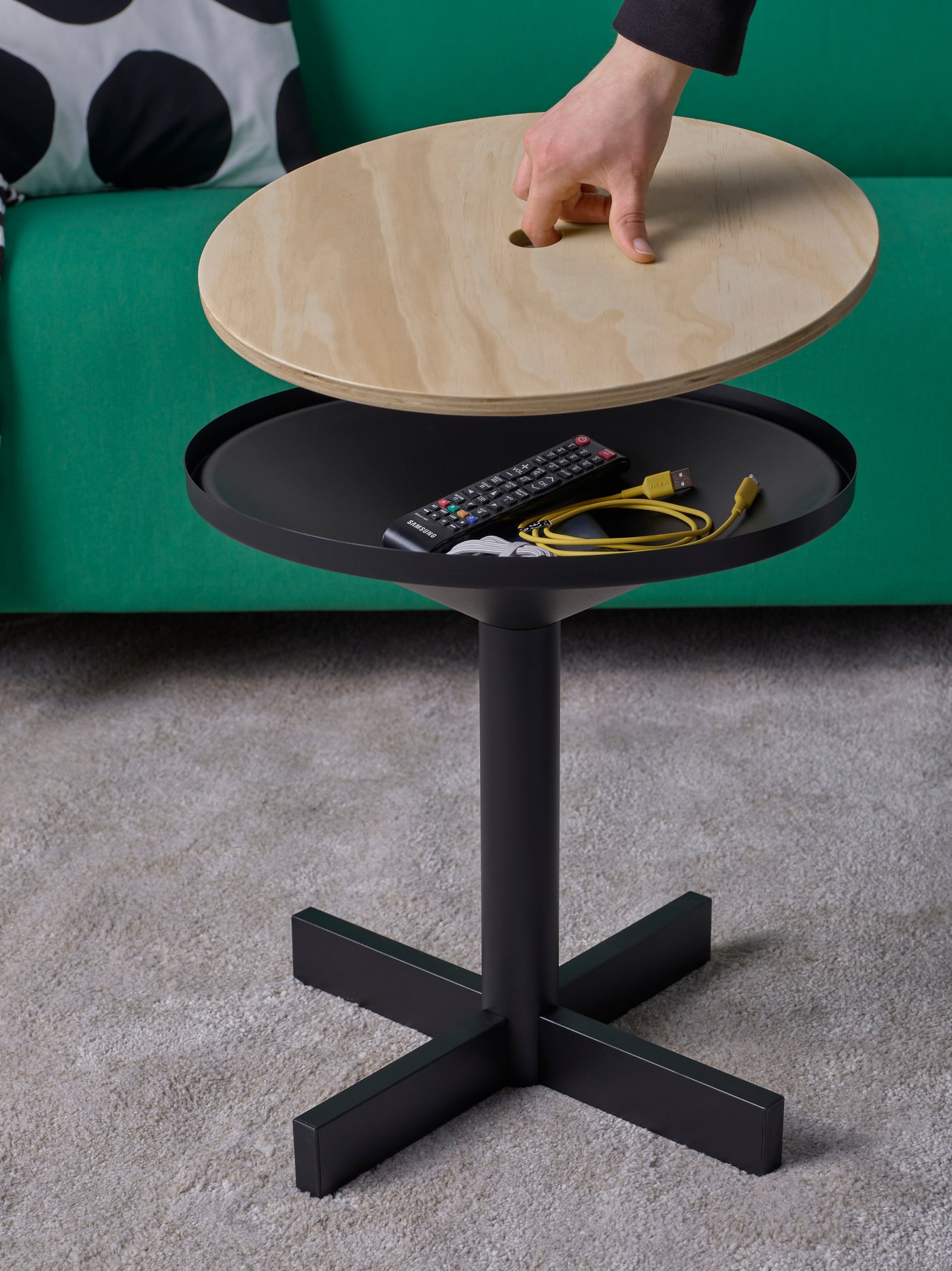 Coffe table with removable top being lifted to reveal storage beneath. 