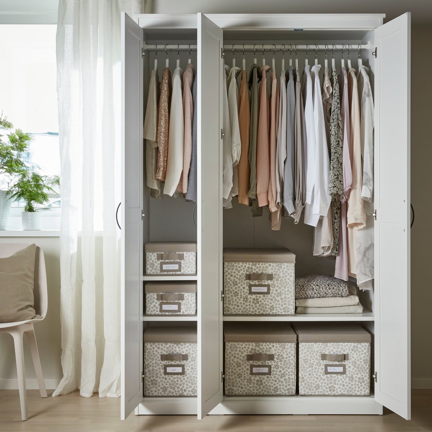 A white SONGESAND wardrobe