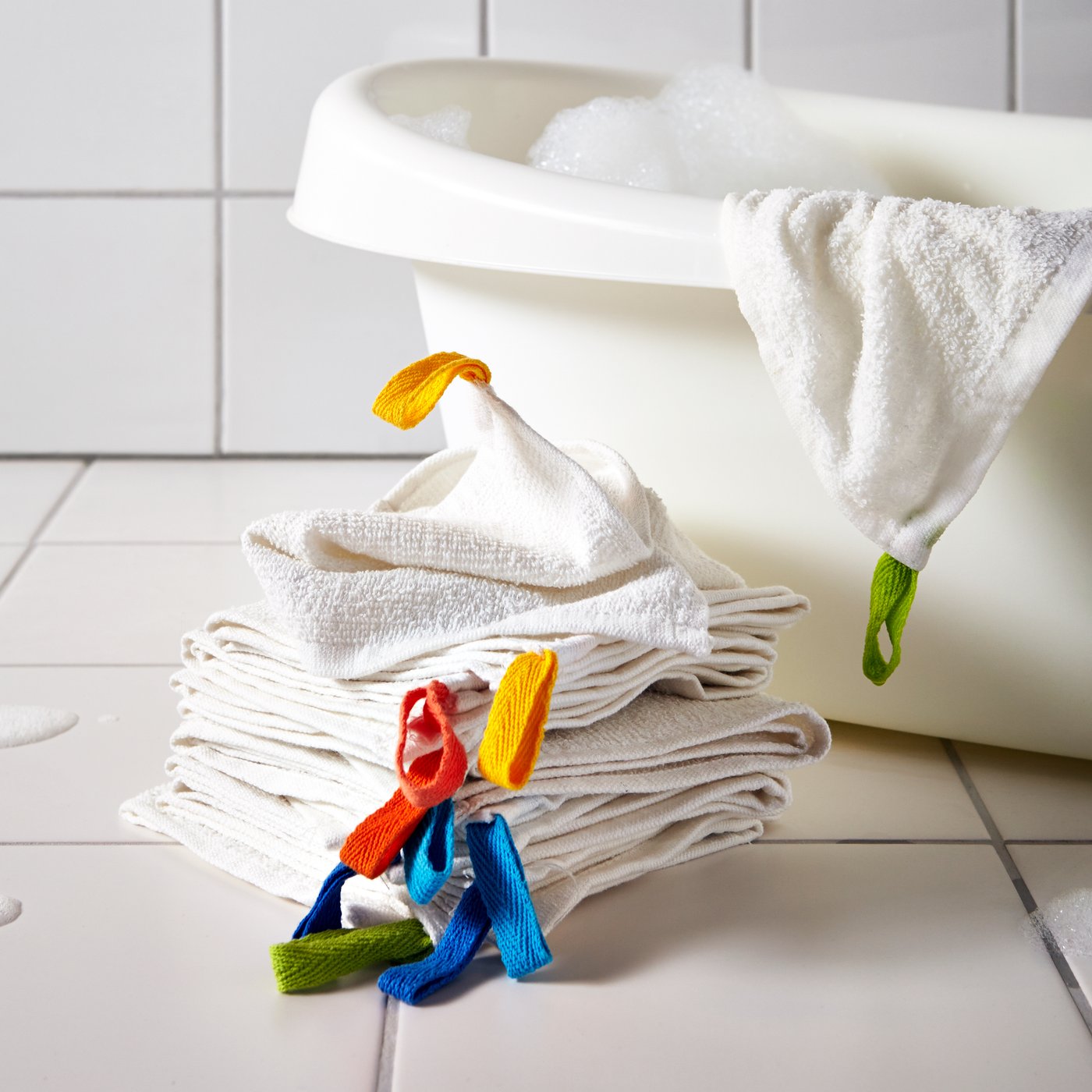 A white KRAMA washcloth in the bathroom