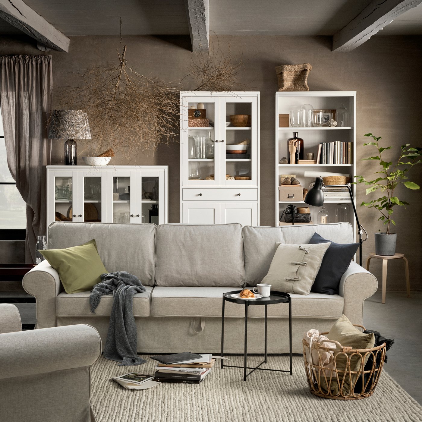 An olive-green GURLI cushion cover