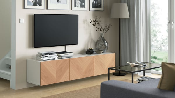 A white/Hedeviken oak veneer BESTÅ TV bench with doors in the living room