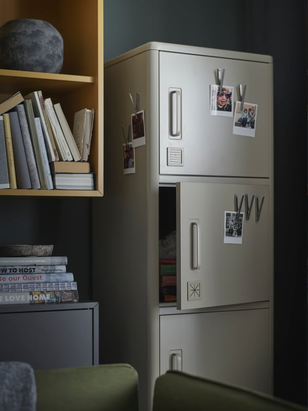 A beige IDÅSEN high cabinet with drawer and doors in the home office