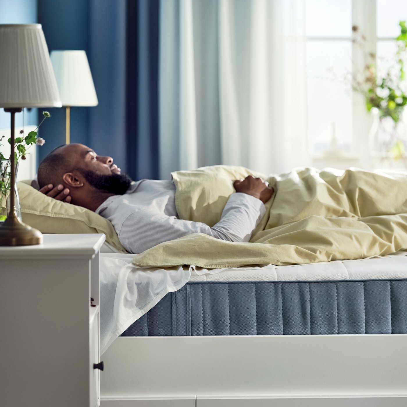 A firm/light blue VESTERÖY pocket sprung mattress