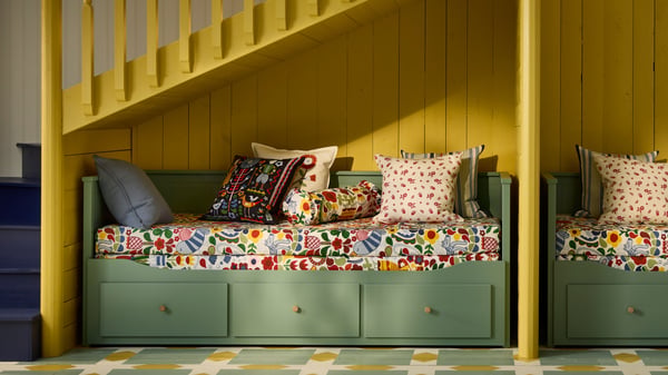 A multicolour TRATTKAKTUS cushion cover in the bedroom