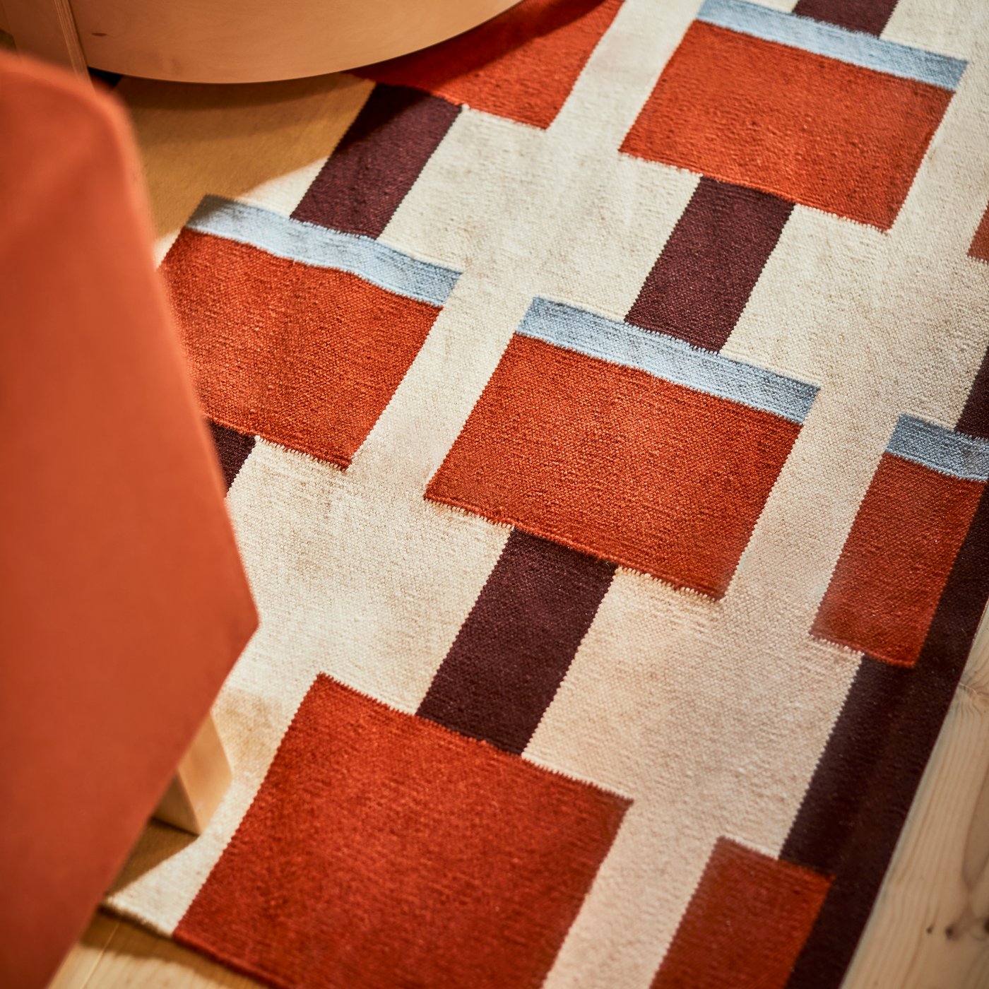 A white/brown/light blue handwoven STOCKHOLM 2025 rug, flatwoven