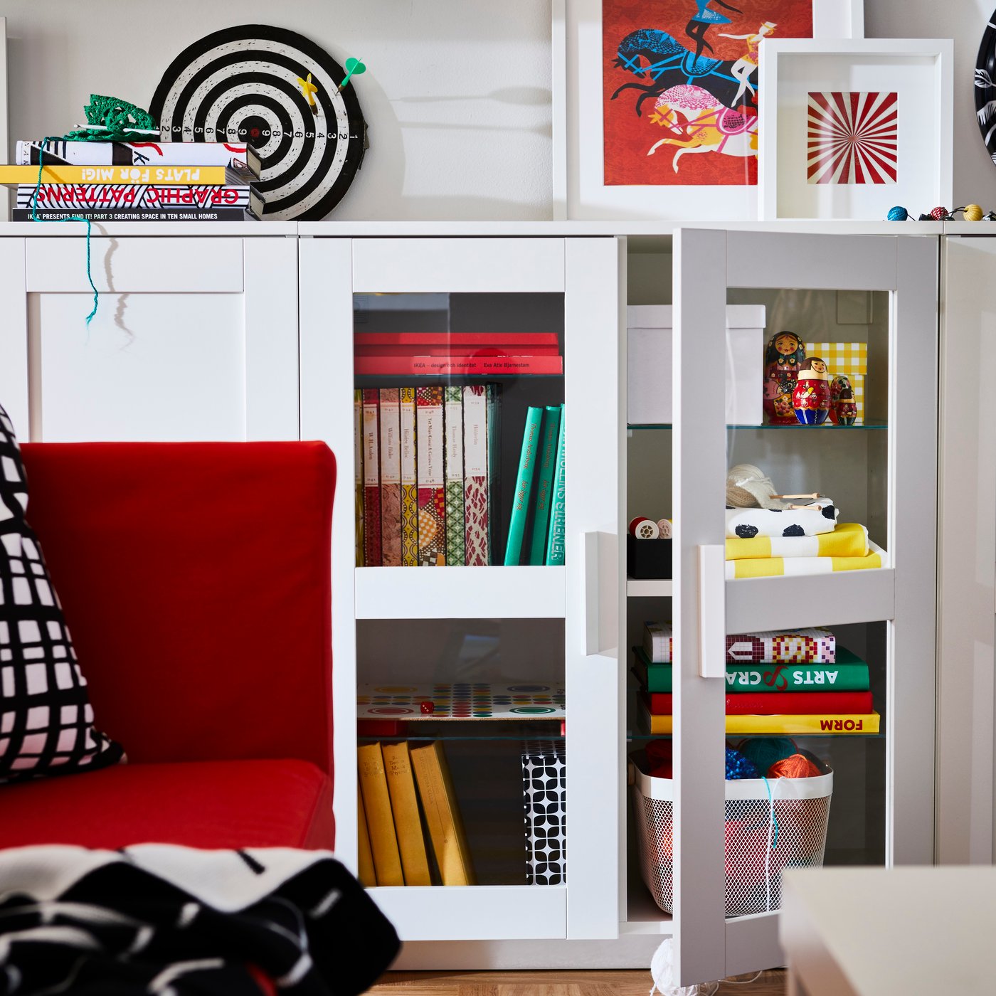 A glass/white BRIMNES cabinet with doors