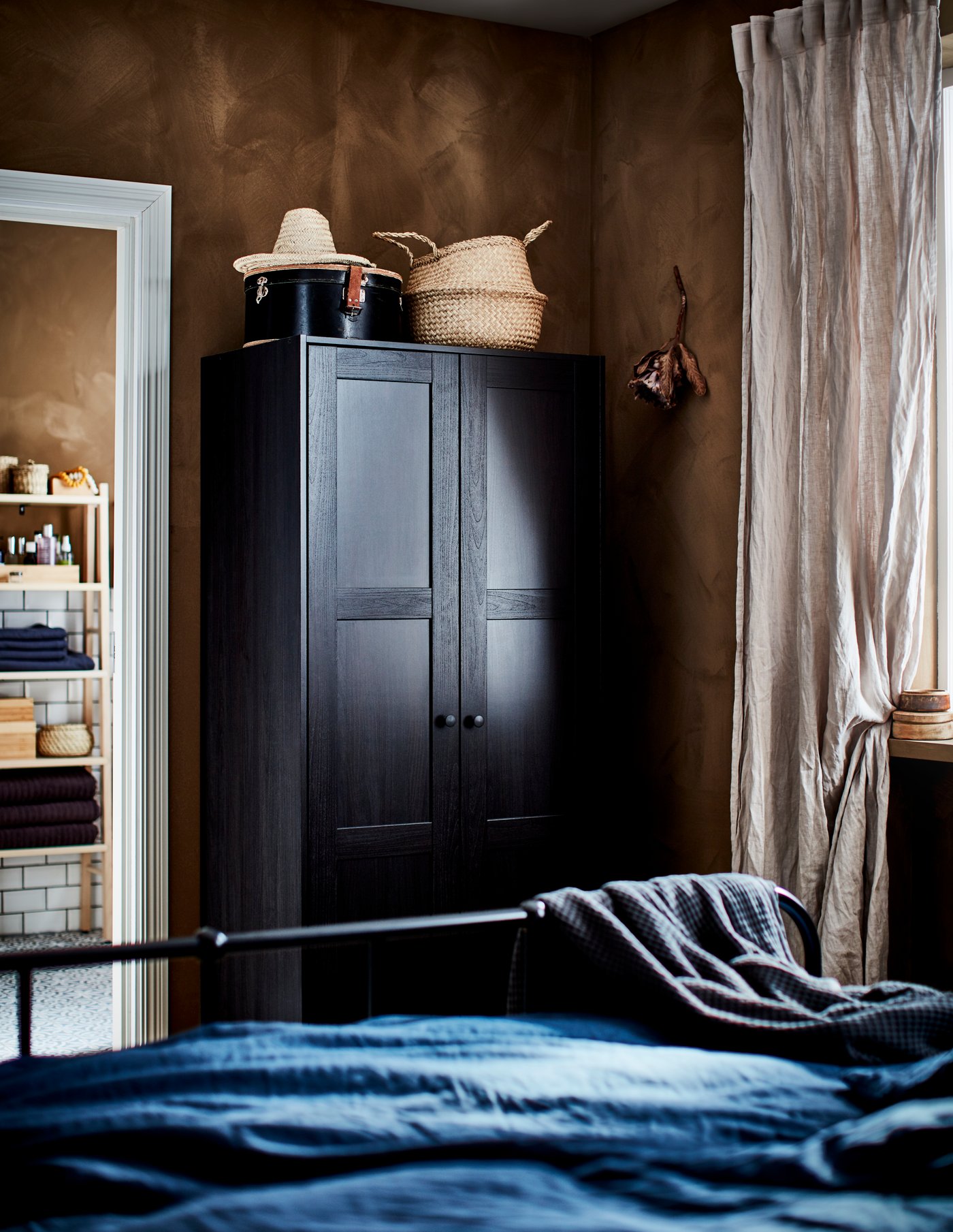 A black-brown RAKKESTAD wardrobe with 2 doors