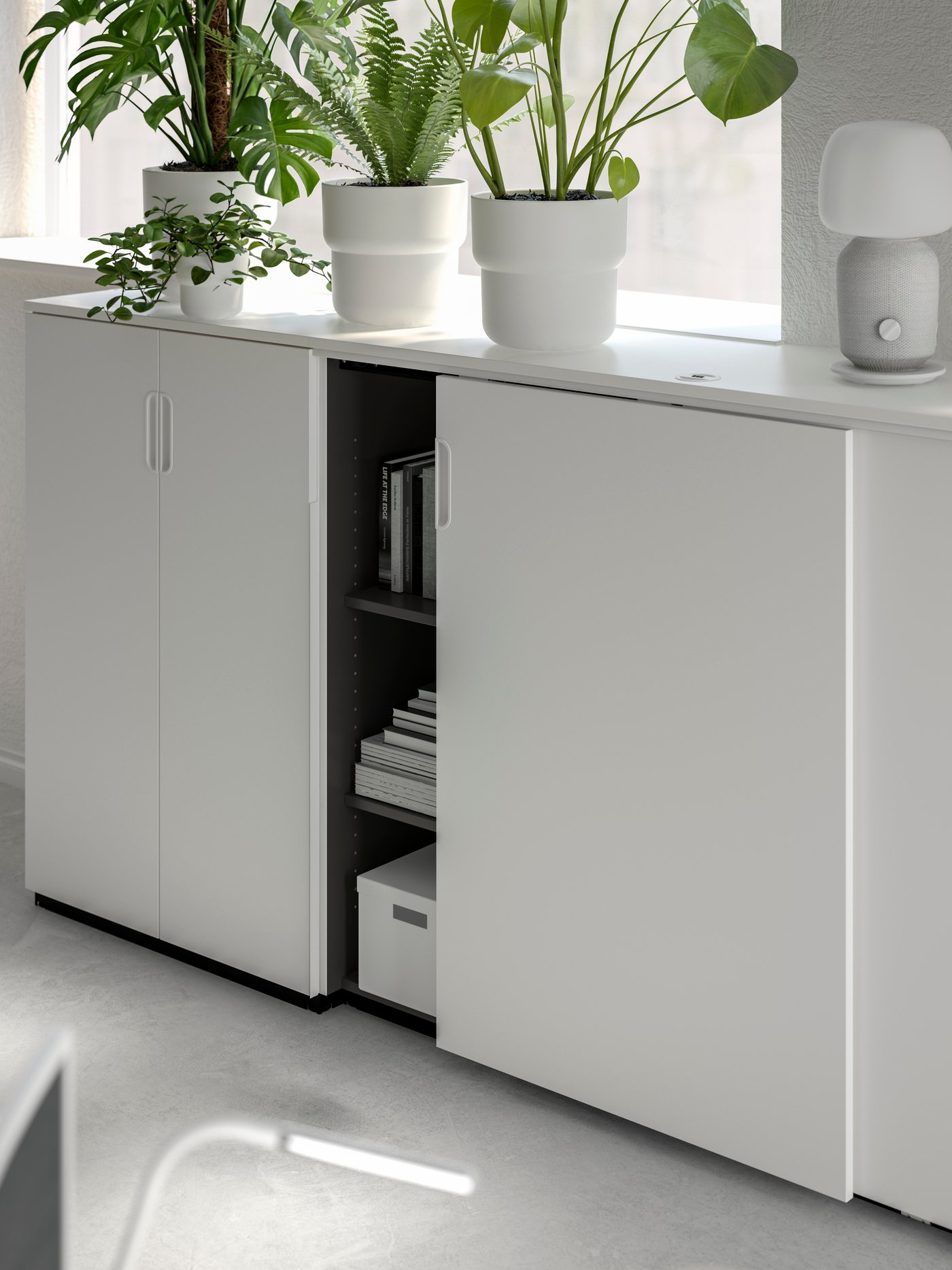 A white GALANT cabinet with sliding doors