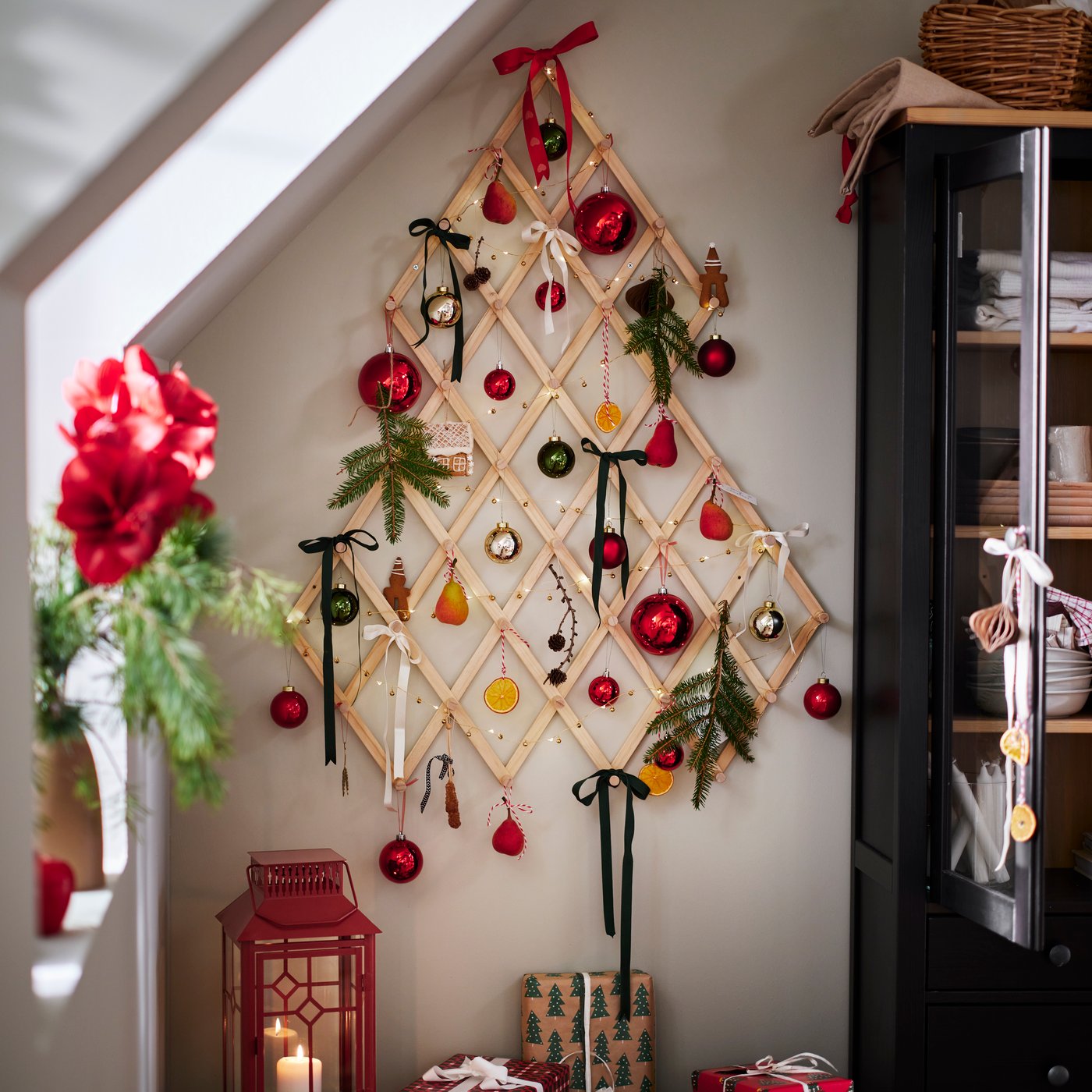 On a wall is a VINTERFINT tree-shaped wall decoration with baubles and VINTERFINT tree decorations.