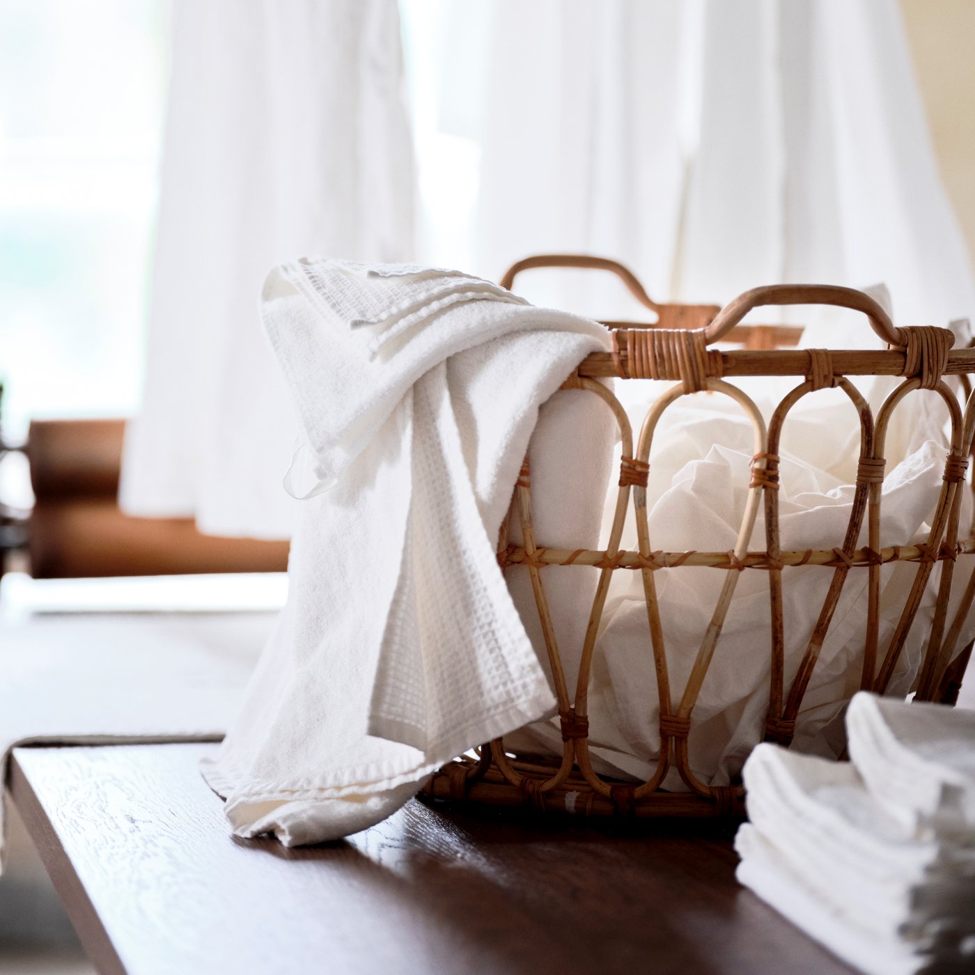 A rattan SNIDAD basket in the laundry room