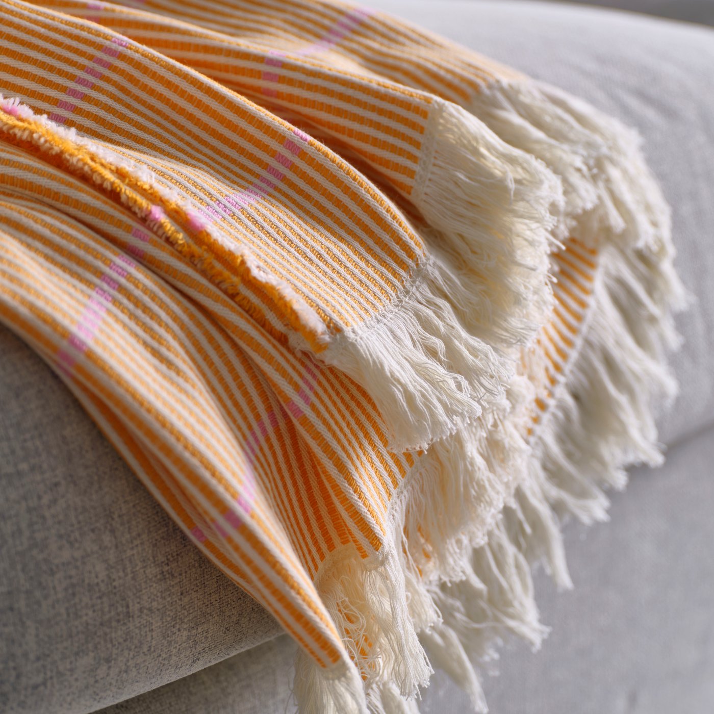 A bright orange/pink LAPPKATTFOT throw in the NA