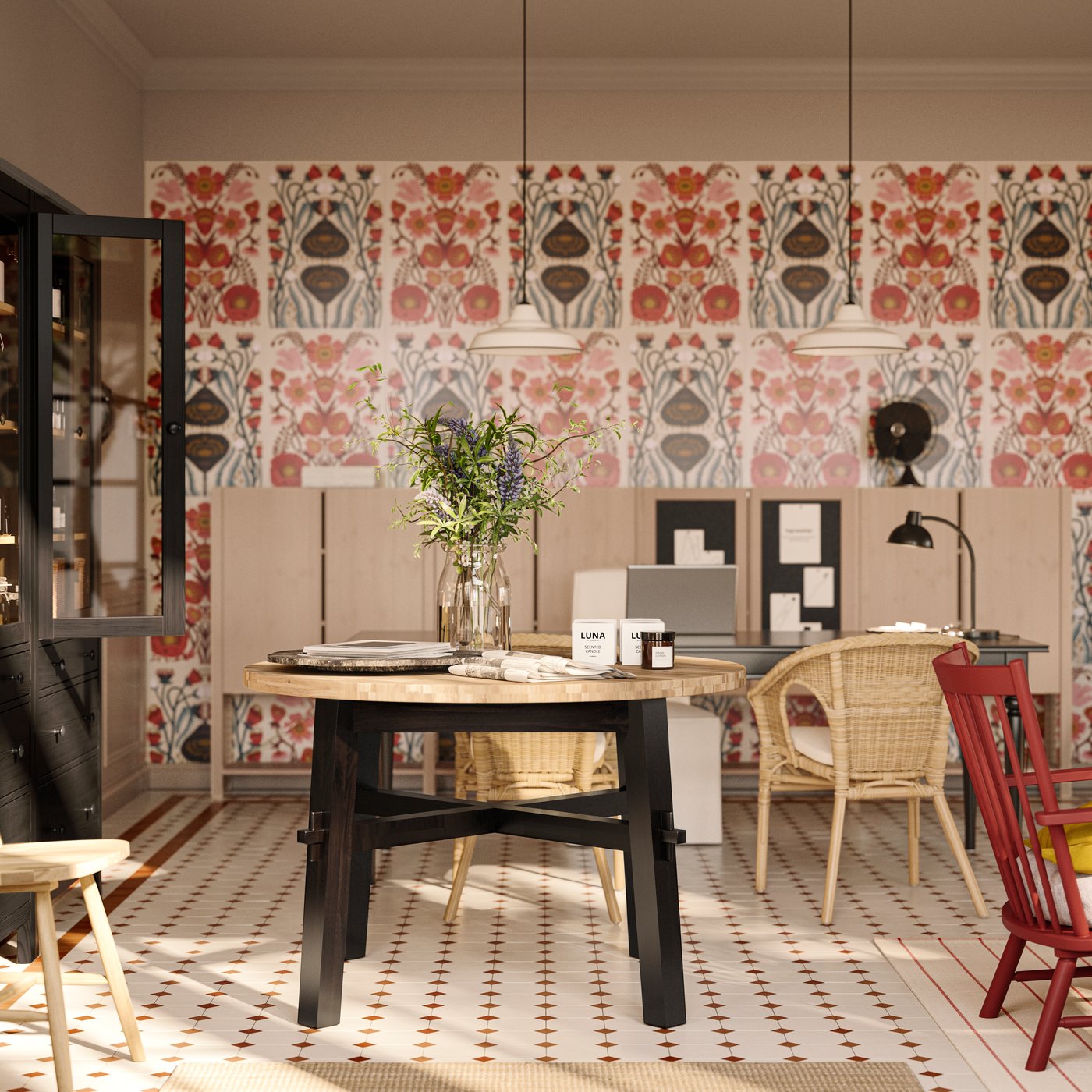 A SKOGSTA dining table with an acacia top and black legs holds a vase and other items, in a bed and breakfast’s reception.