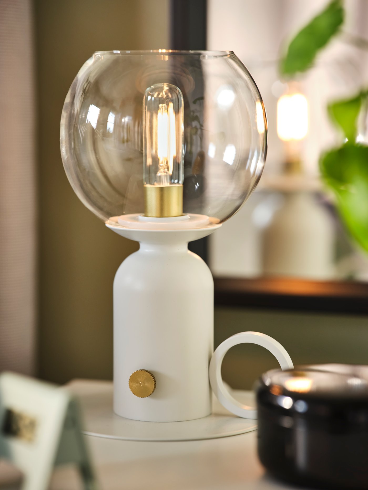 A white ÅSKMULLER table lamp