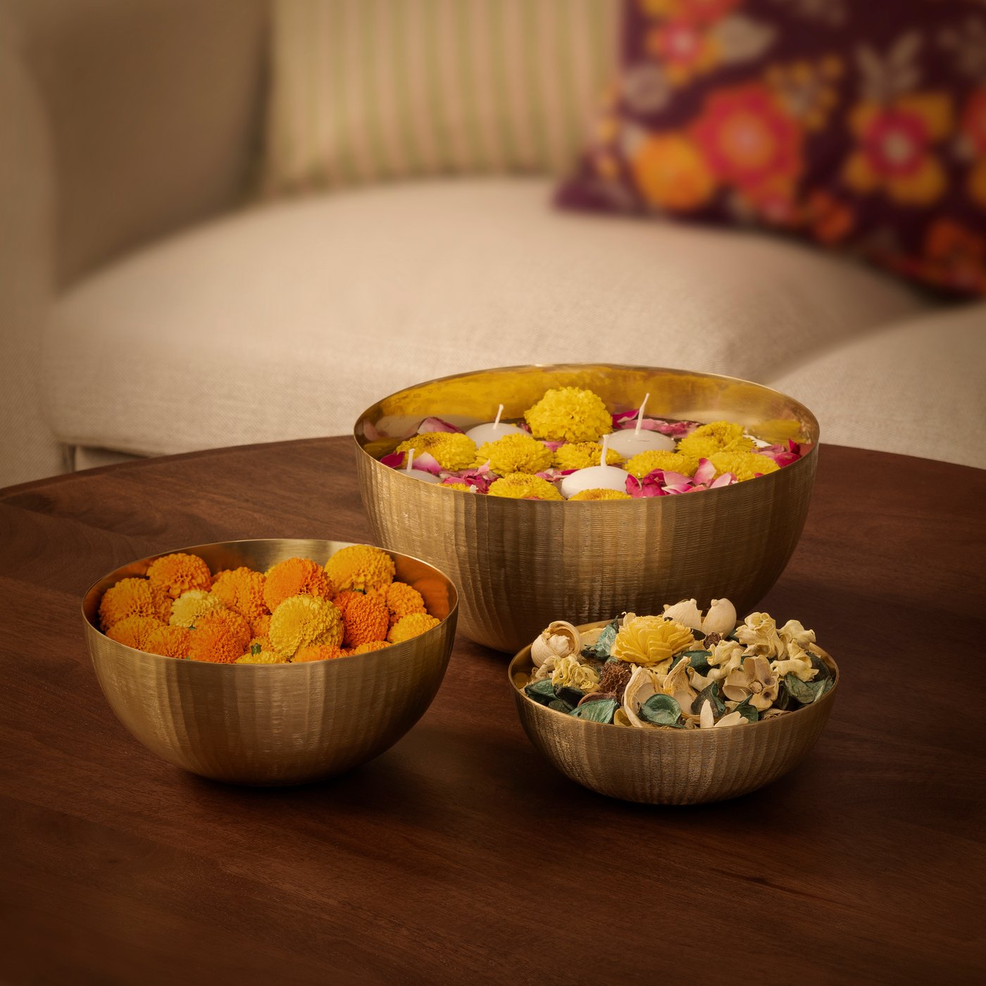 A gold-colour AROMATISK decorative bowl