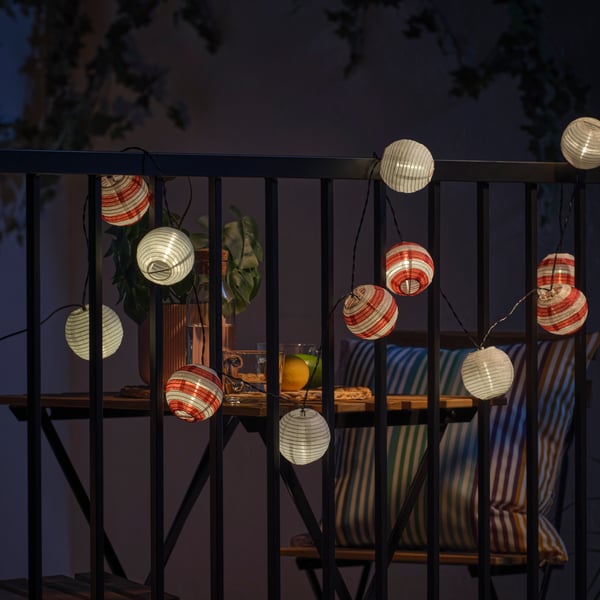 A solar-powered outdoor/red stripe SOLVINDEN LED lighting chain with 12 lights