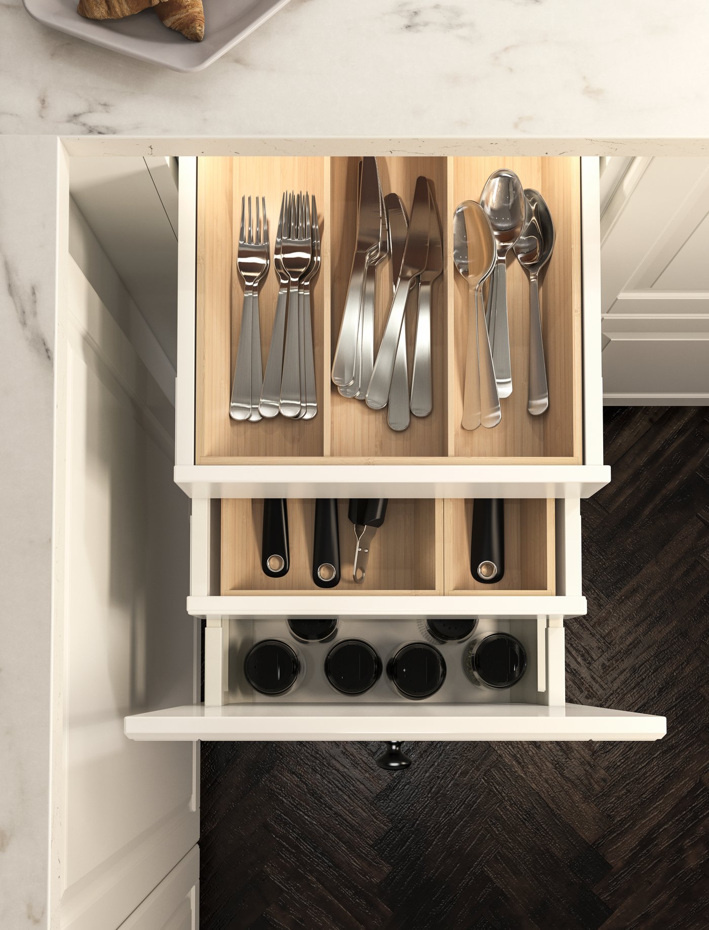 A light bamboo UPPDATERA cutlery tray in the kitchen